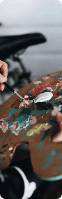 Painter mixing colors on a palette