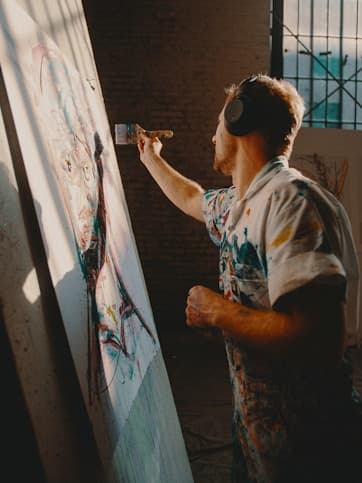 artist working on a large painting