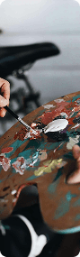 Painter mixing colors on a palette